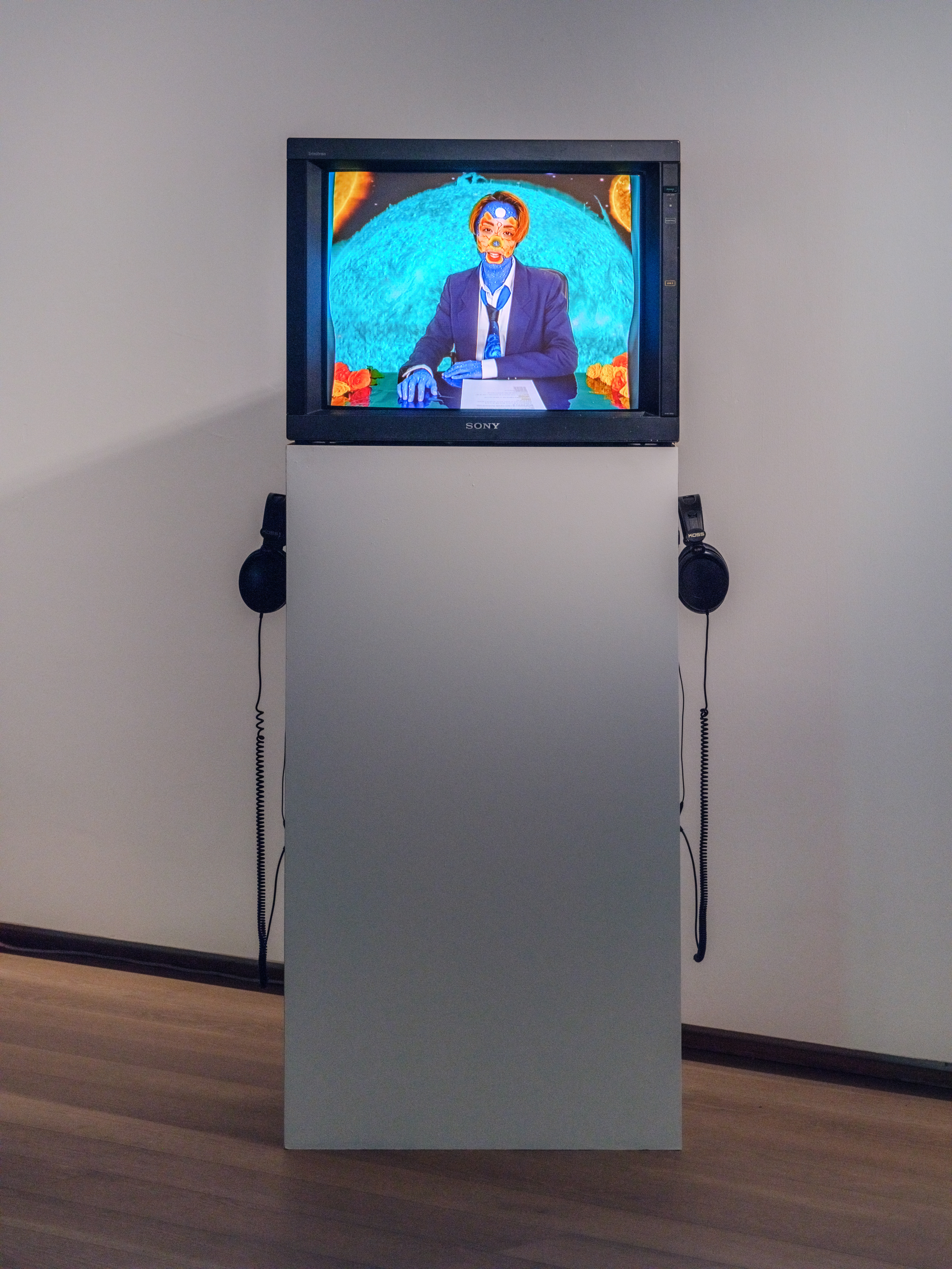 Box TV on a pedestal with video artwork Todays Top Stories