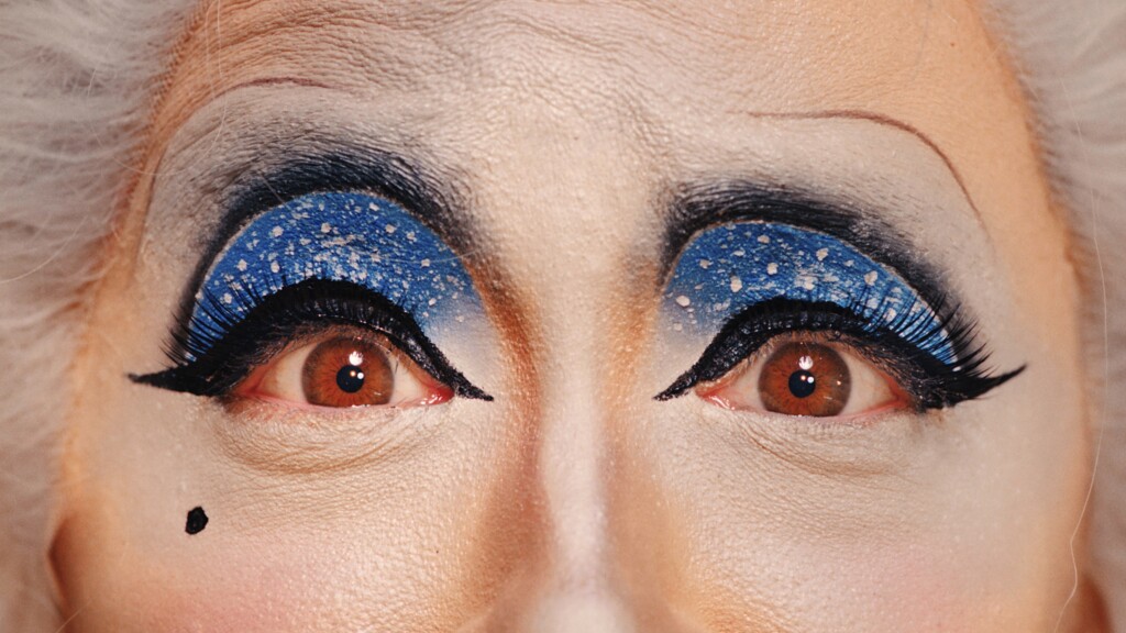 Close up of pair of eyes with heavy sky makeup