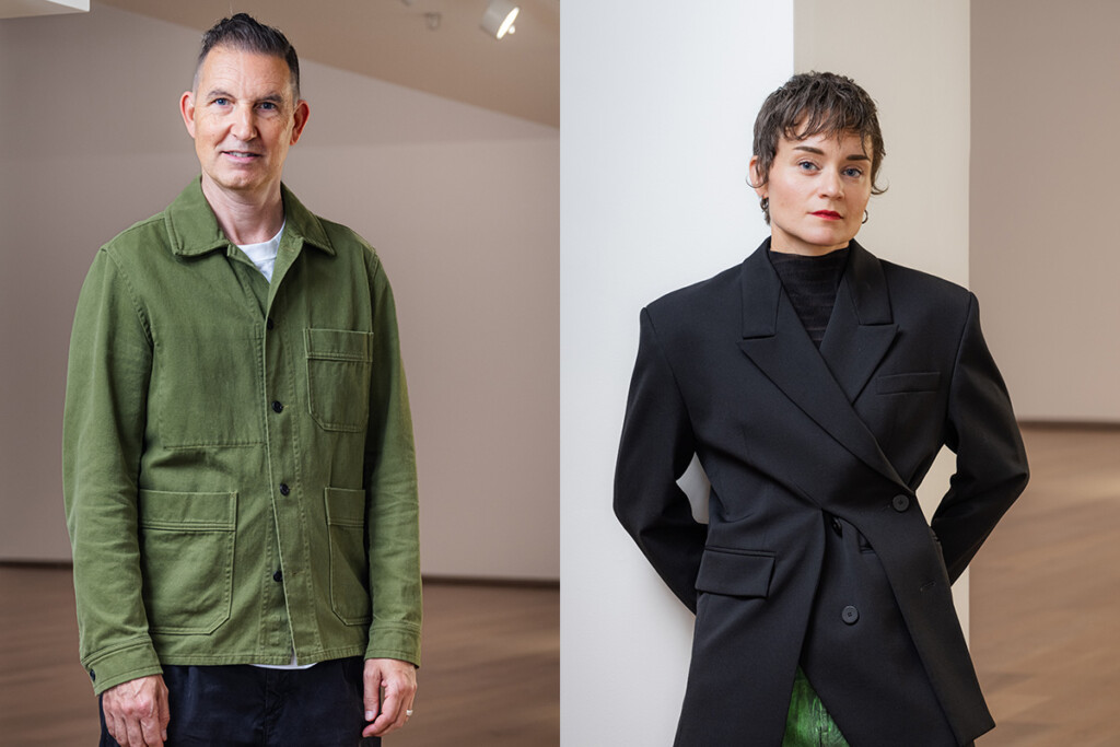 Two curators standing next to each other